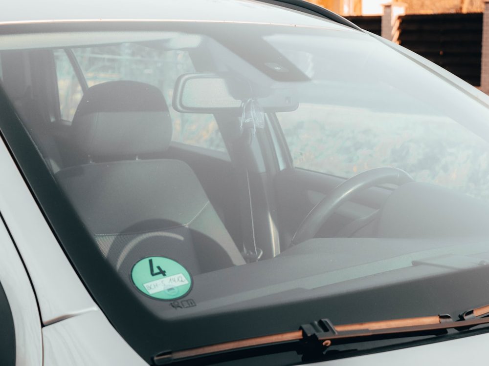 ADAS camera and sensors mounted behind a vehicle windshield